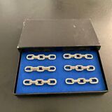 6 porte-couteaux, bijoux de table, forme chaîne en métal
