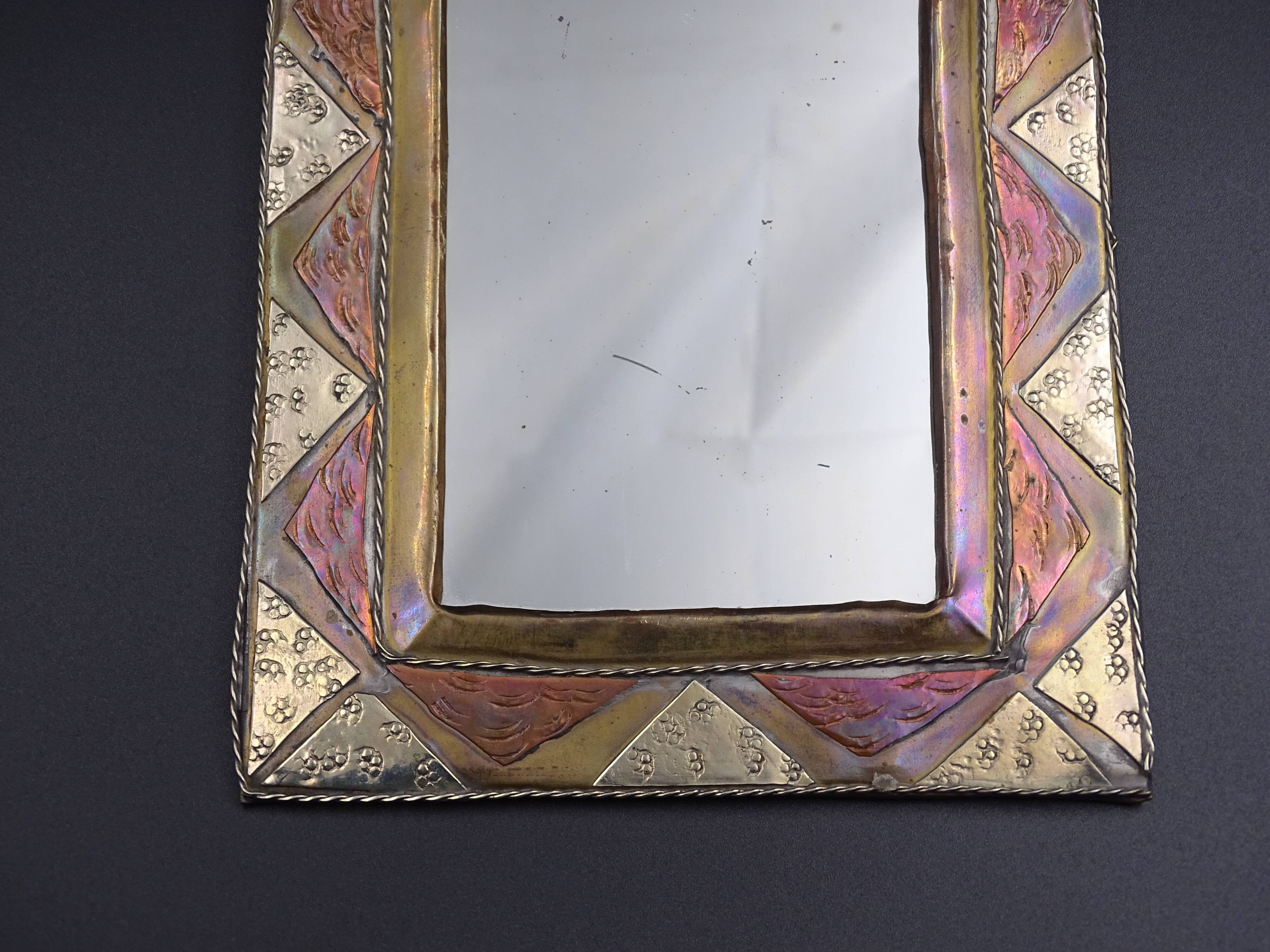 Oriental mirror in worked copper 24x15cm