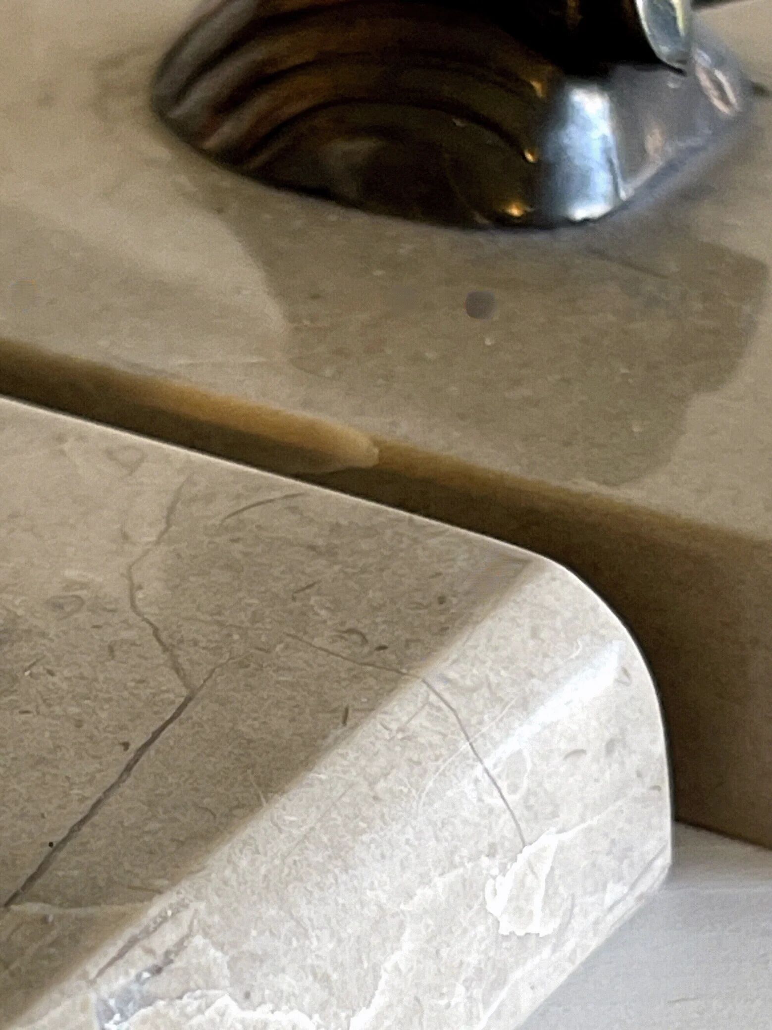 Art Deco bookends with patinated ibex in a taupe marble base.