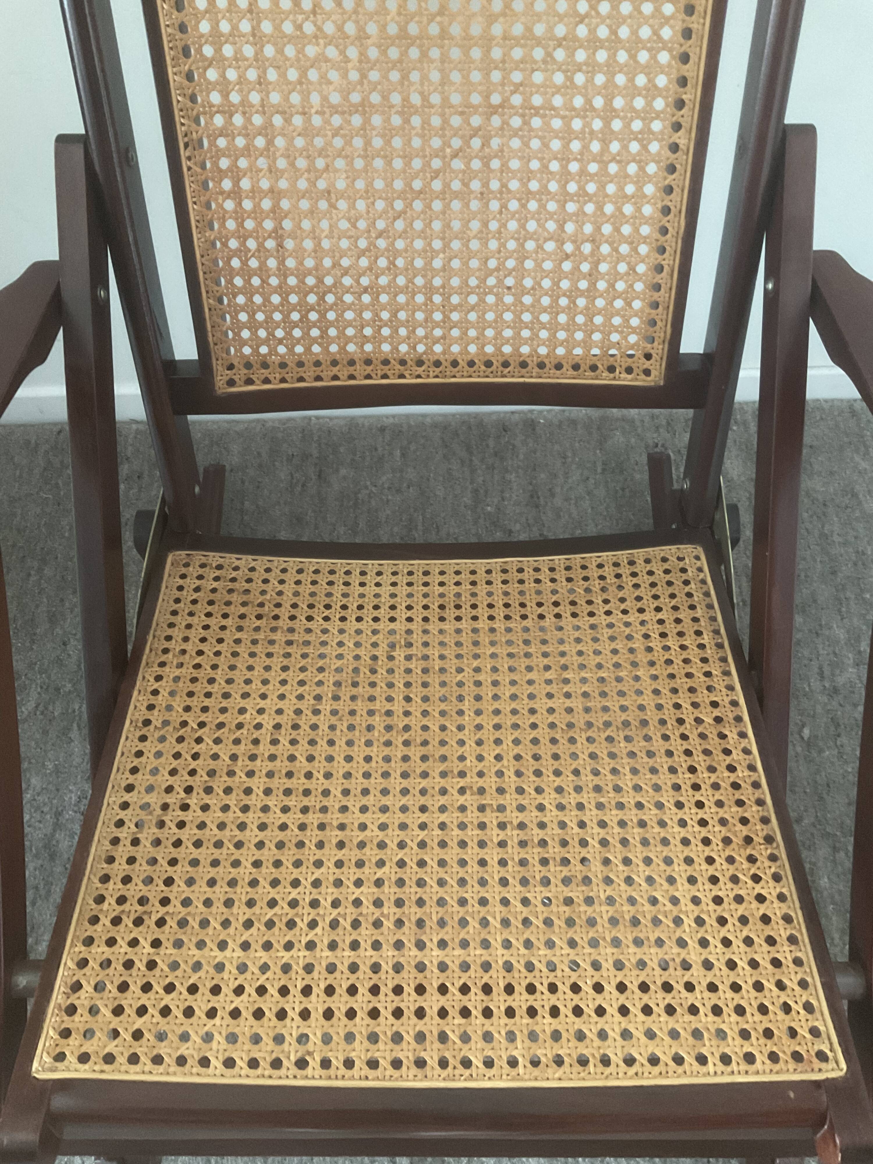 Folding wooden rocking chair and cannage from the 70s