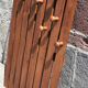 Wall-mounted coat rack in wood or wall hook.