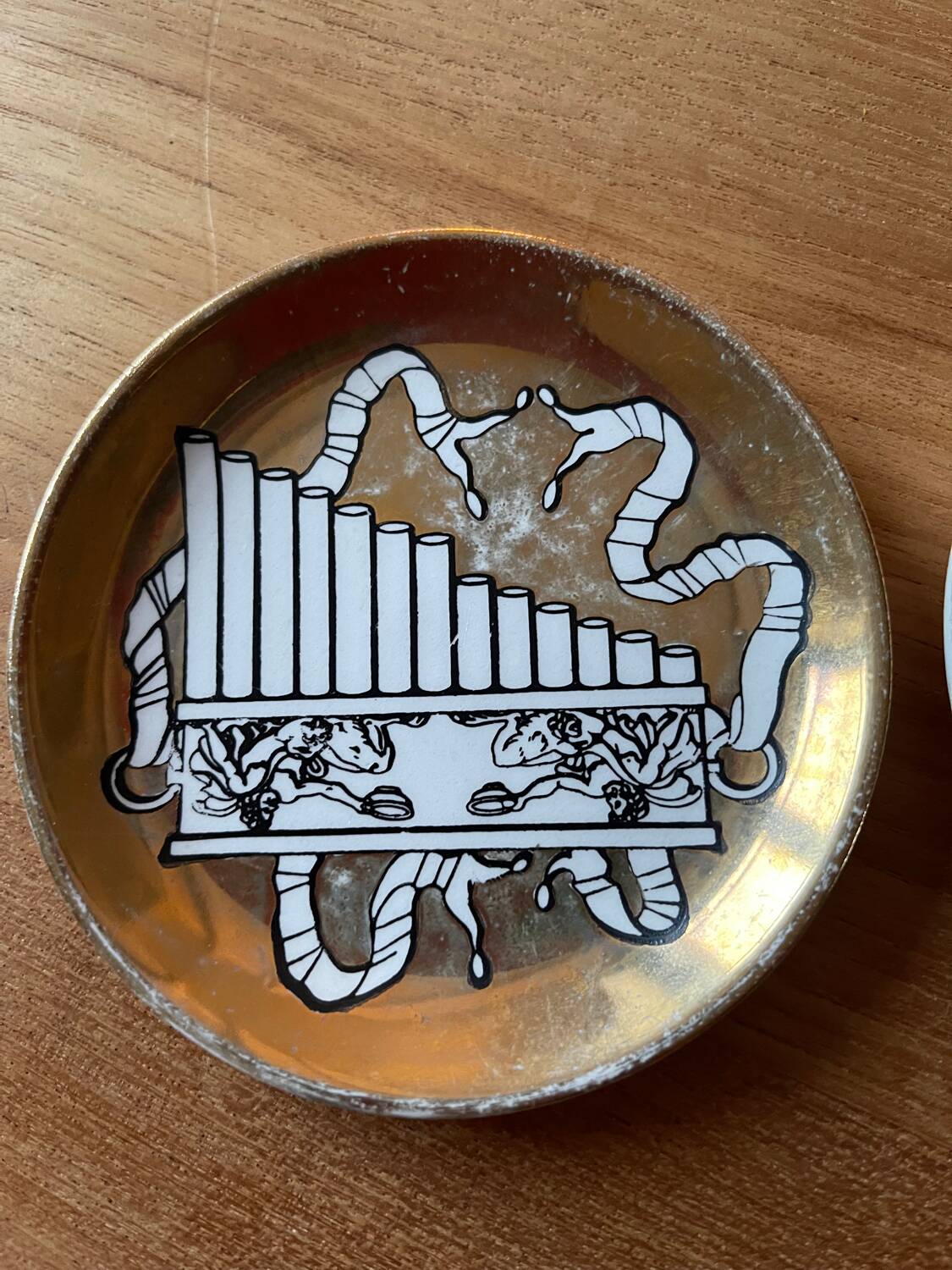 Small Fornasetti plates