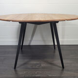 Ercol round drop leaf dining table - black leg, 1960