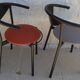 4 gondola-style chairs with a sturdy metal frame and faux leather.