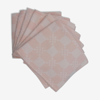 Six pastel pink napkins