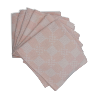 Six pastel pink napkins