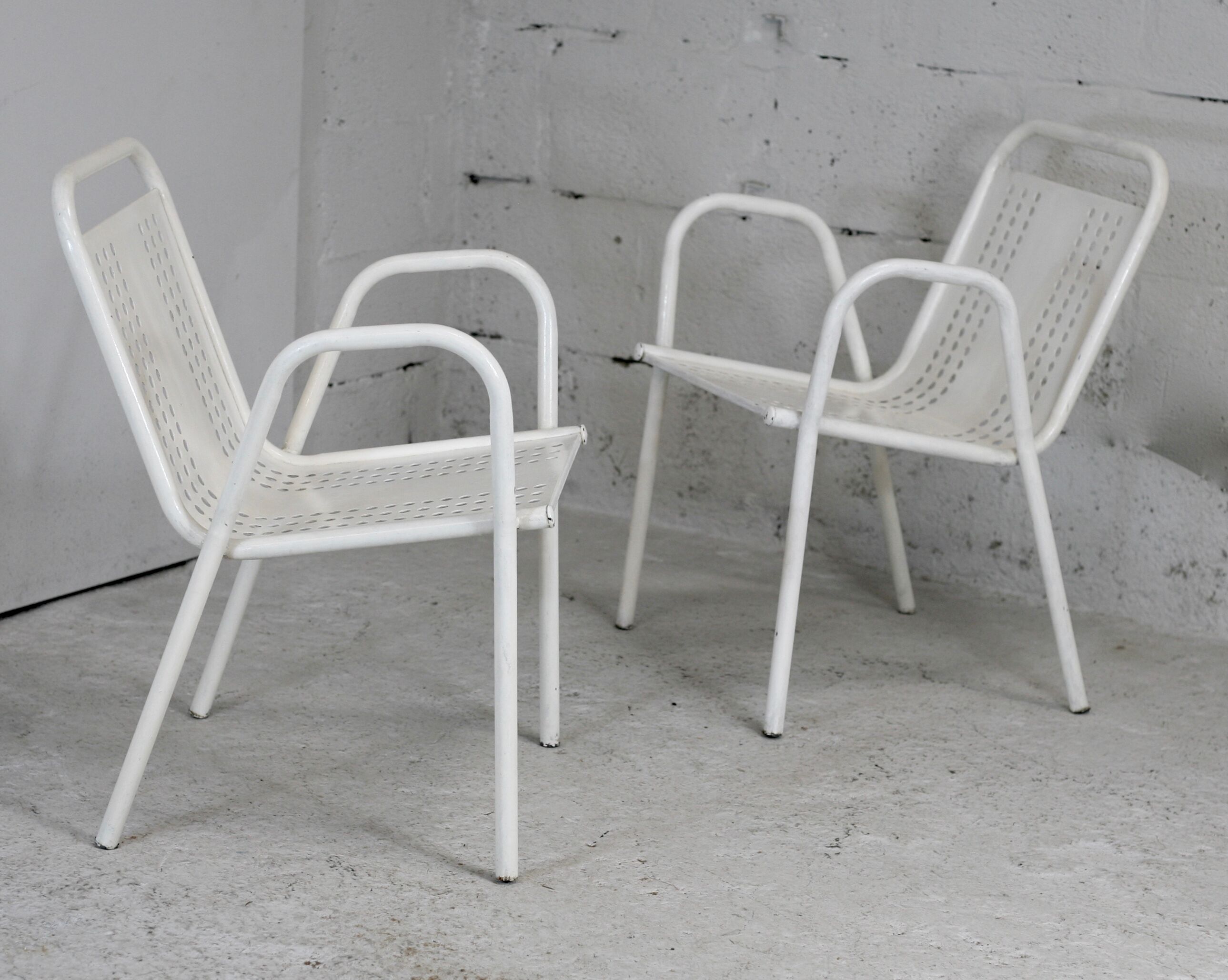 Pair of honeycomb steel armchairs. France, circa 1950.