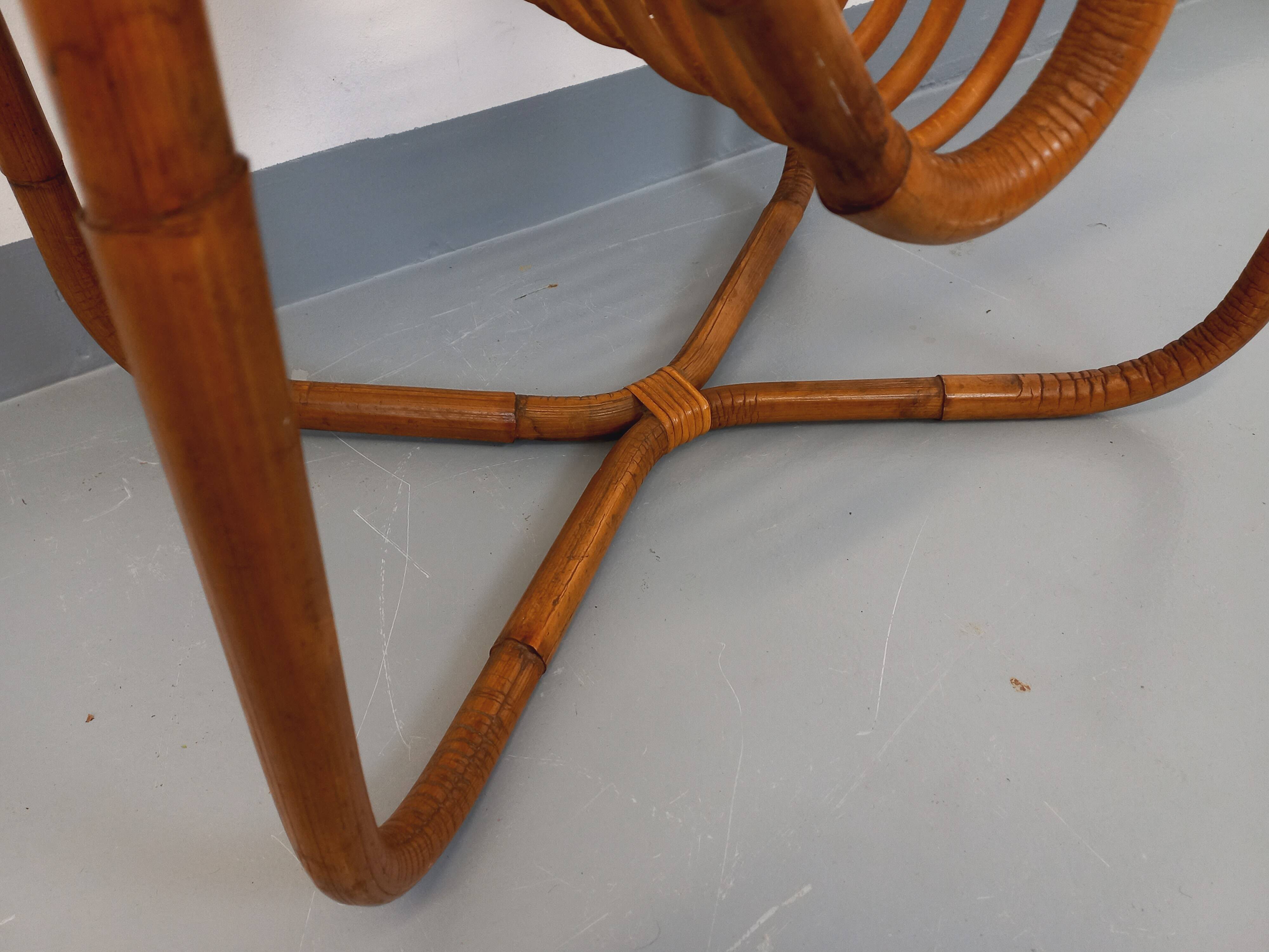 Side table / coffee table with vintage 1960s rattan magazine rack.