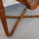 Side table / coffee table with vintage 1960s rattan magazine rack.