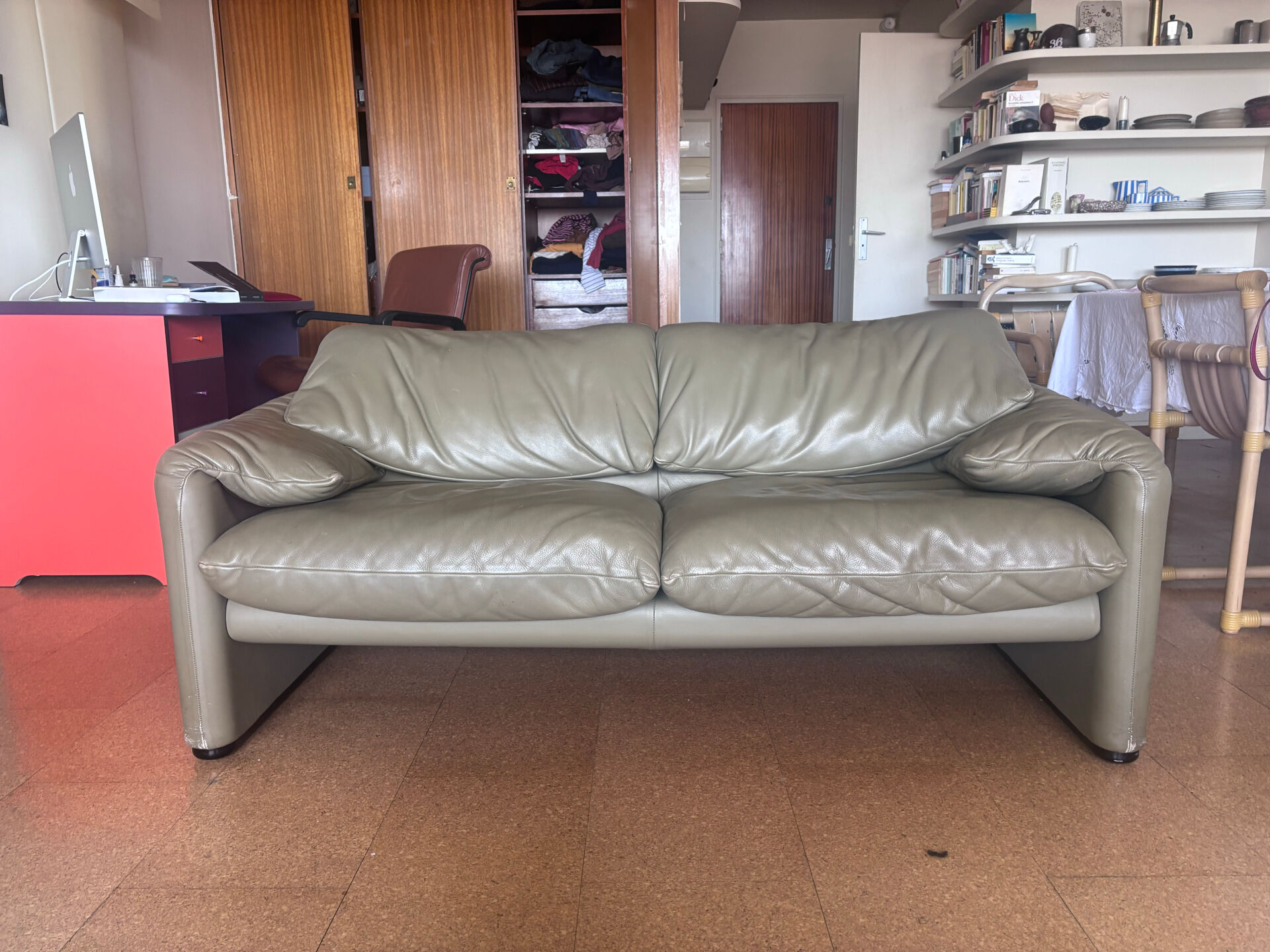 Two-seater Maralunga sofa in olive green leather.