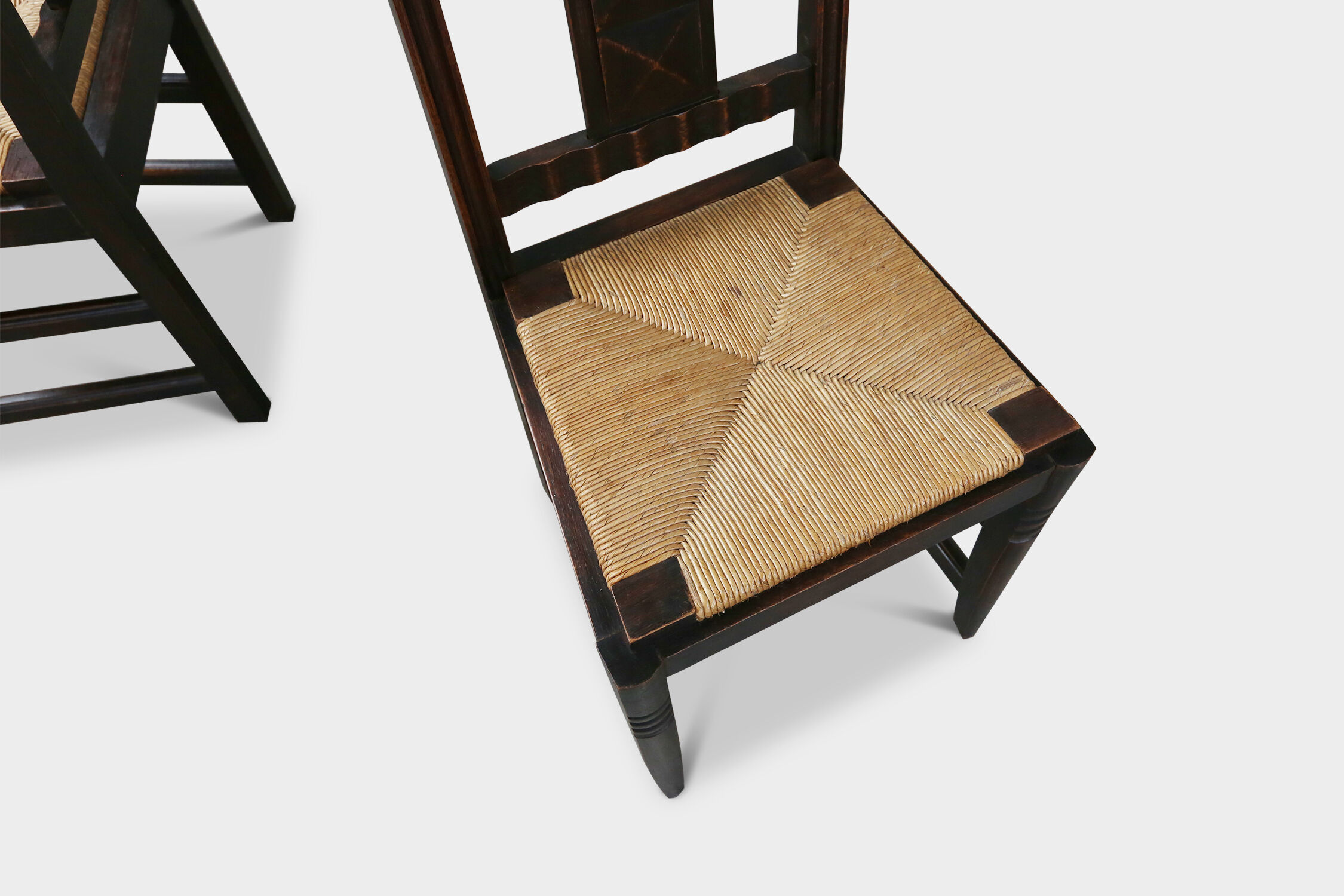 Set of six oak an wicker dining chairs by Victor Courtray