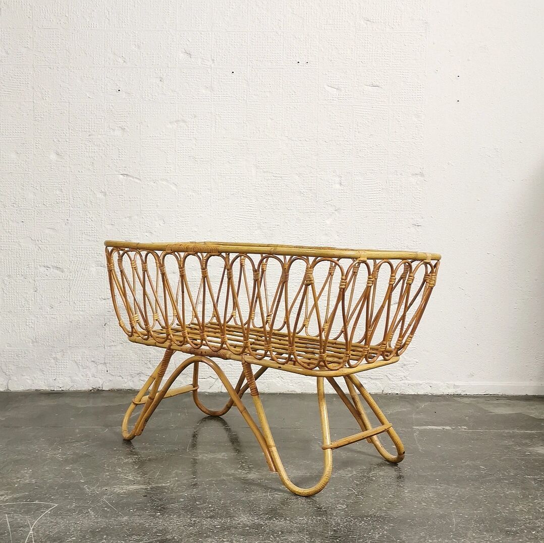 Baby cradle in vintage rattan