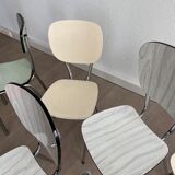 10 mismatched multicolored Formica chairs 60s