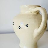 Vintage butter yellow ceramic pitcher in rustic style