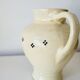 Vintage butter yellow ceramic pitcher in rustic style