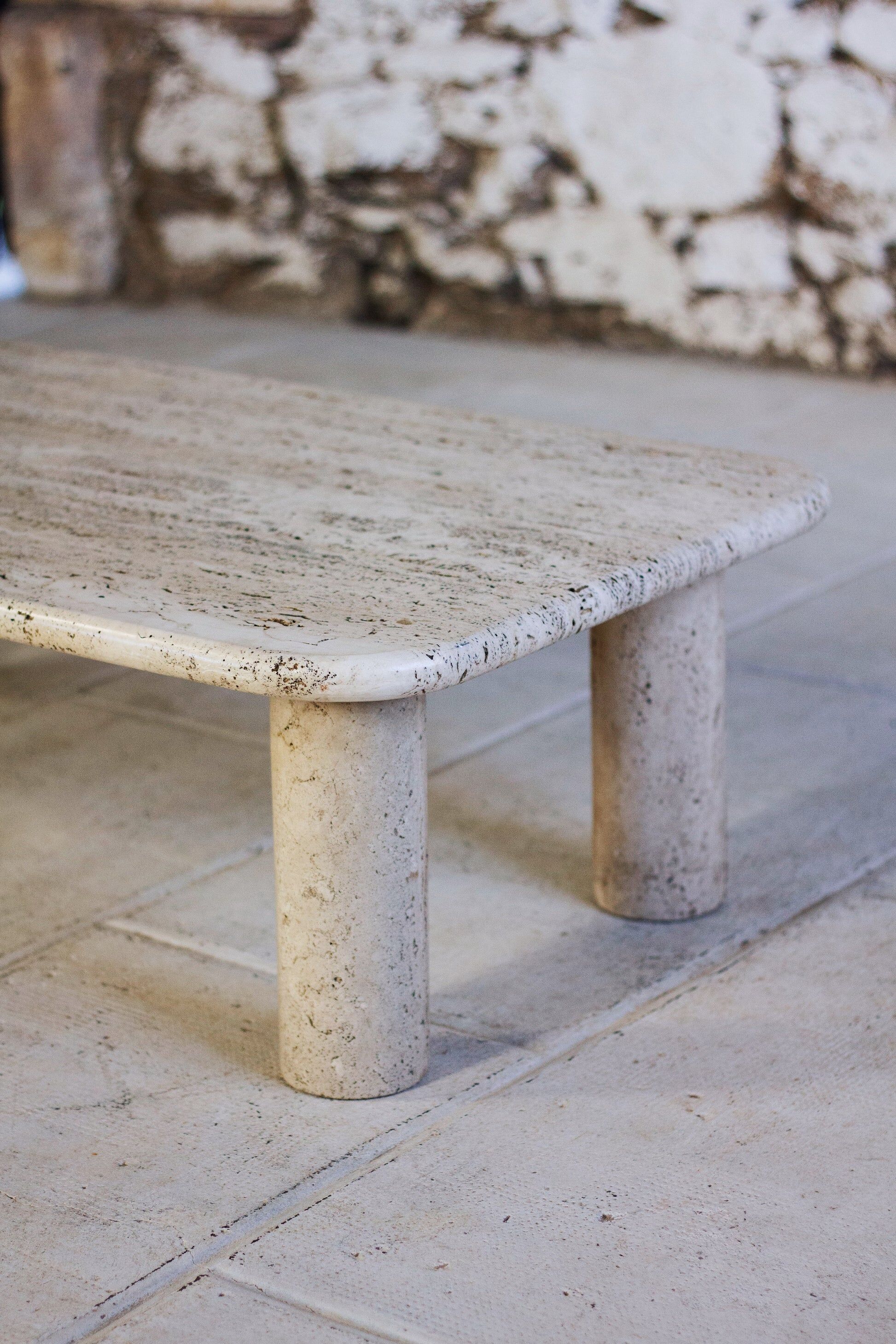 Travertine coffee table in the style of Angelo Mangiarotti, 1970.