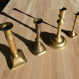 Set of 4 old candle holders in golden brass
