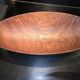 solid wood shuttle with a sleek and organic design.