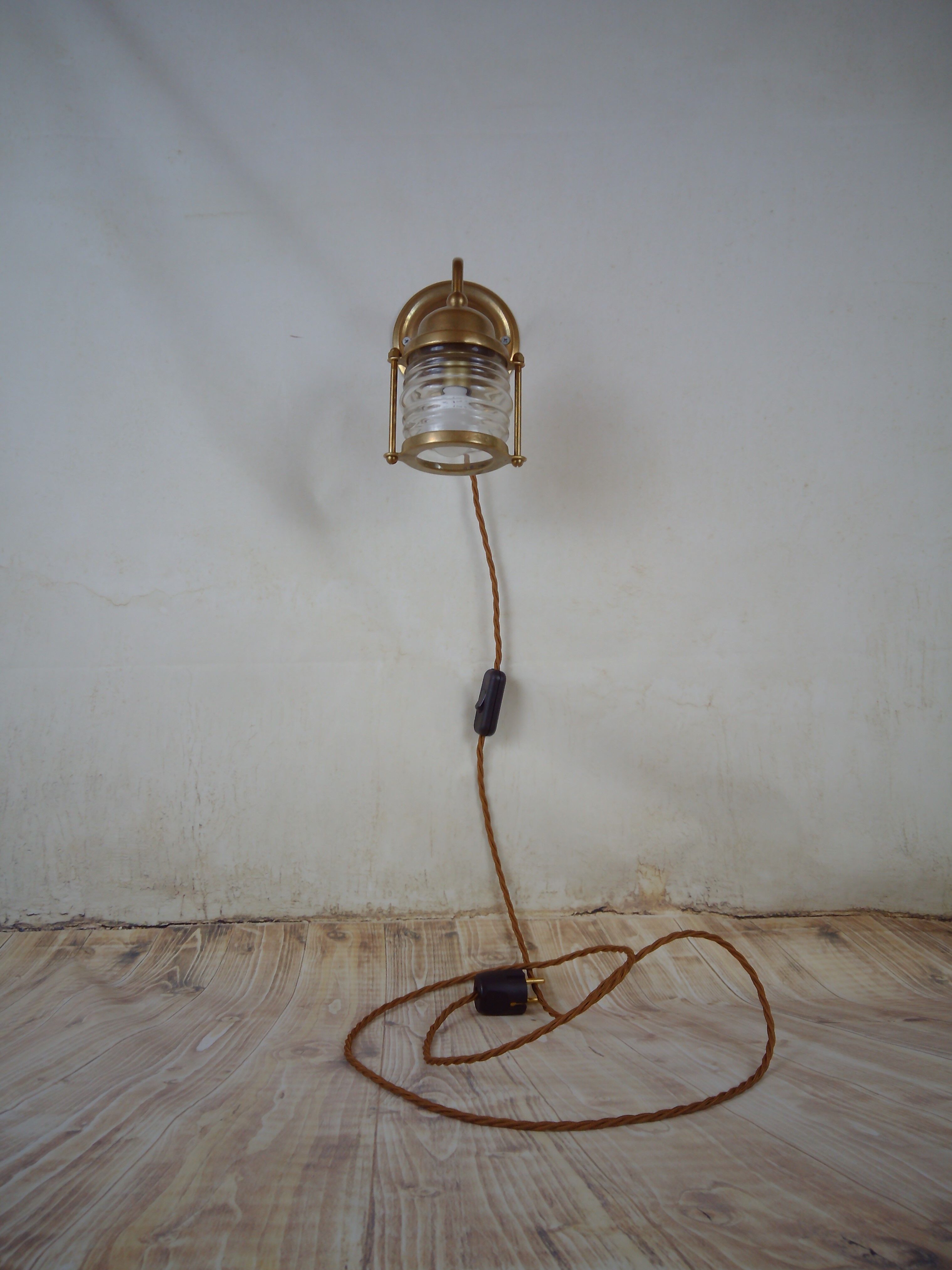 Vintage wallmounted brass lamp from a ship.