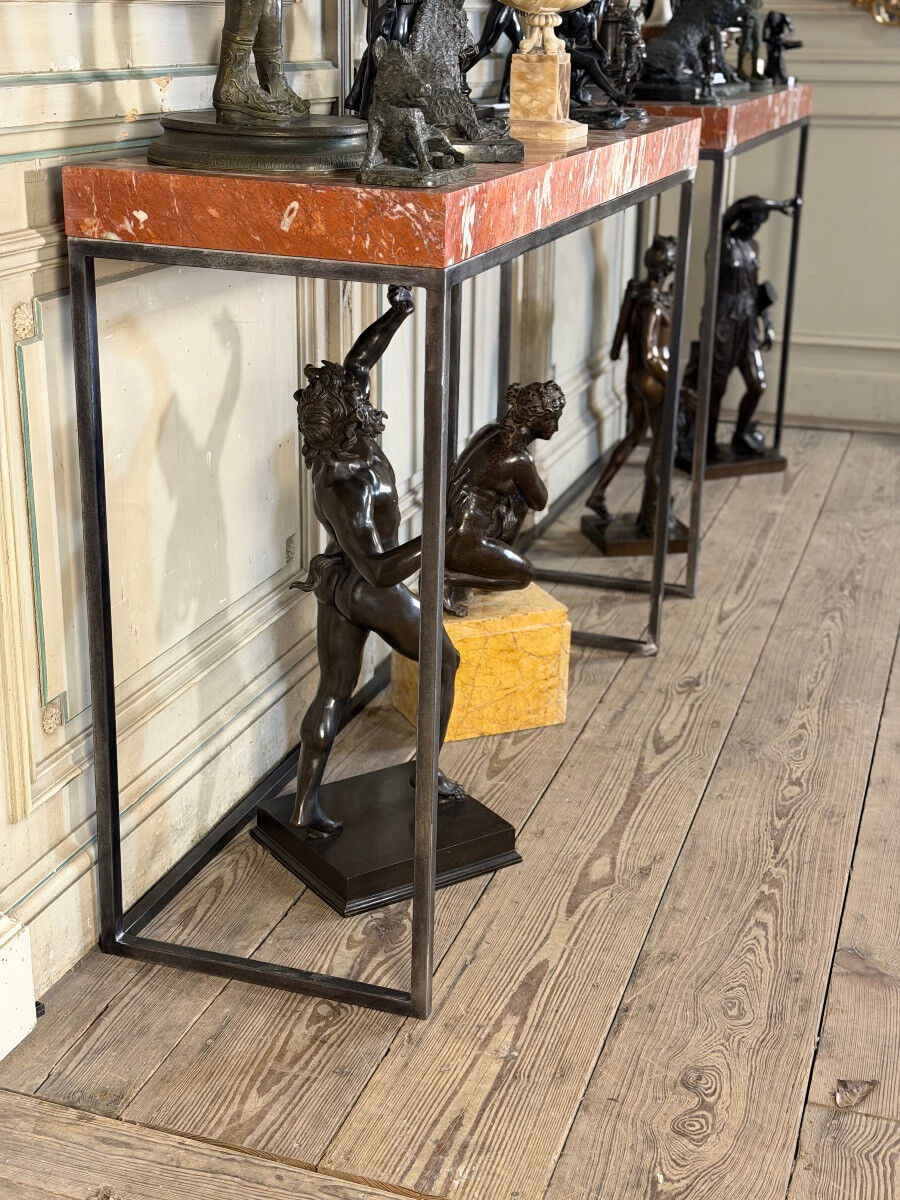 Pair of contemporary consoles in marble and metal.