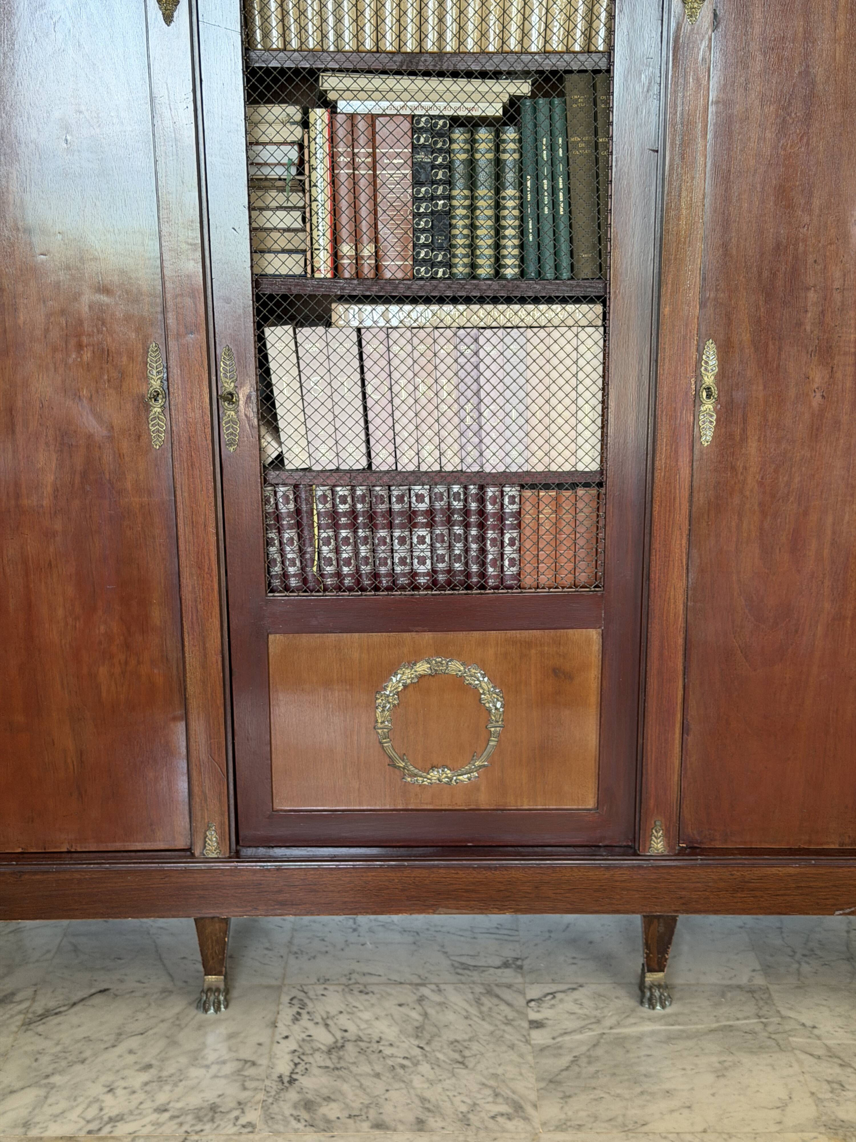 Large antique library from the Empire/Napoleon III period in mahogany and gilded bronze.