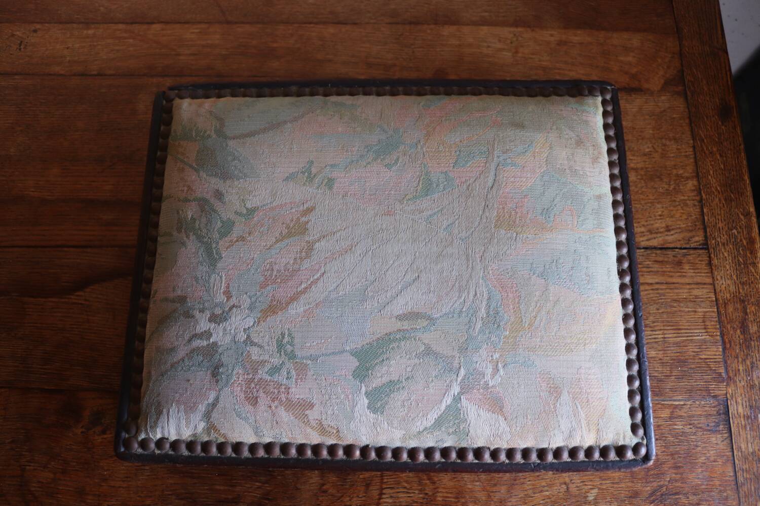 Small antique wooden and fabric footrest.