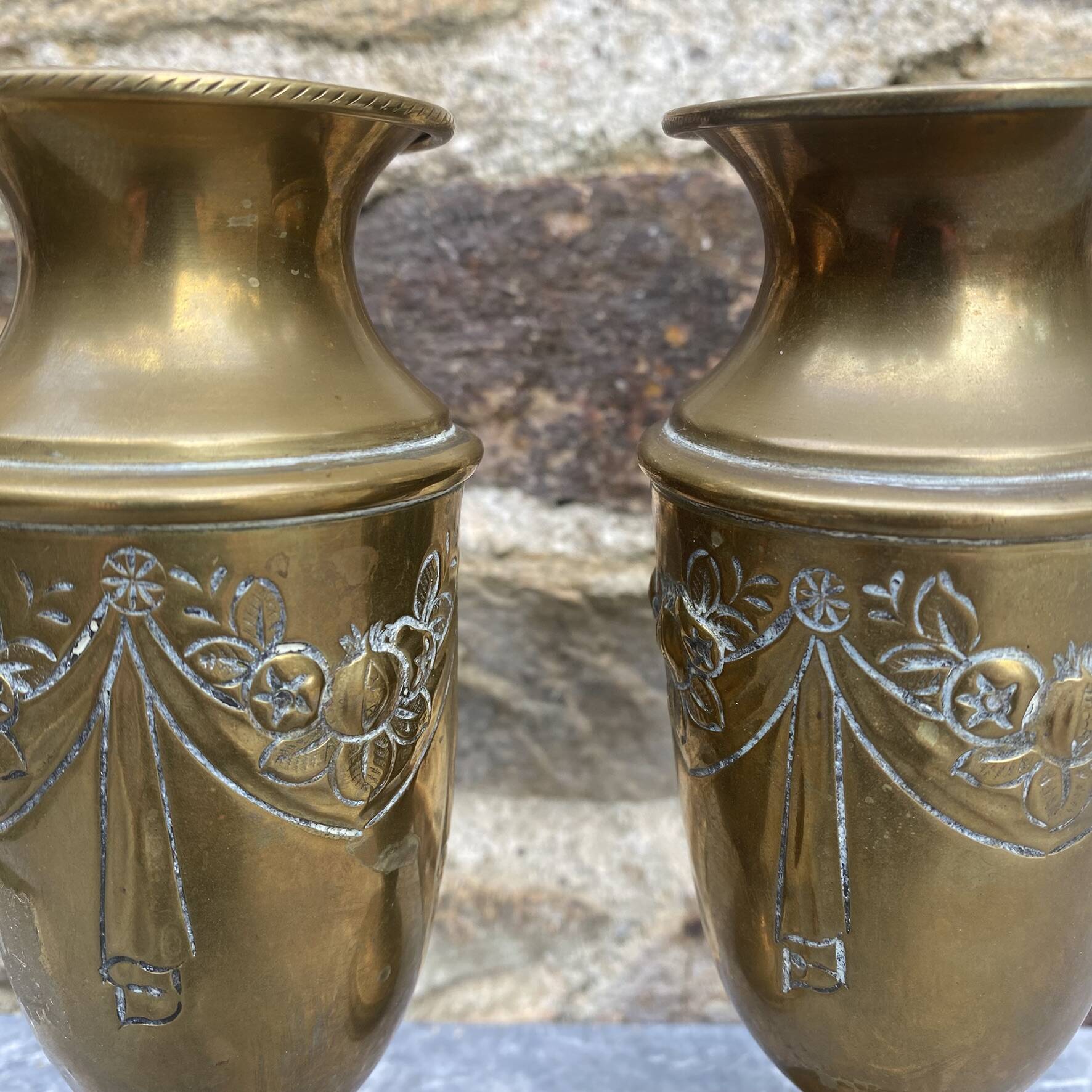 Pair of embossed brass bud vases stamped 17 cm