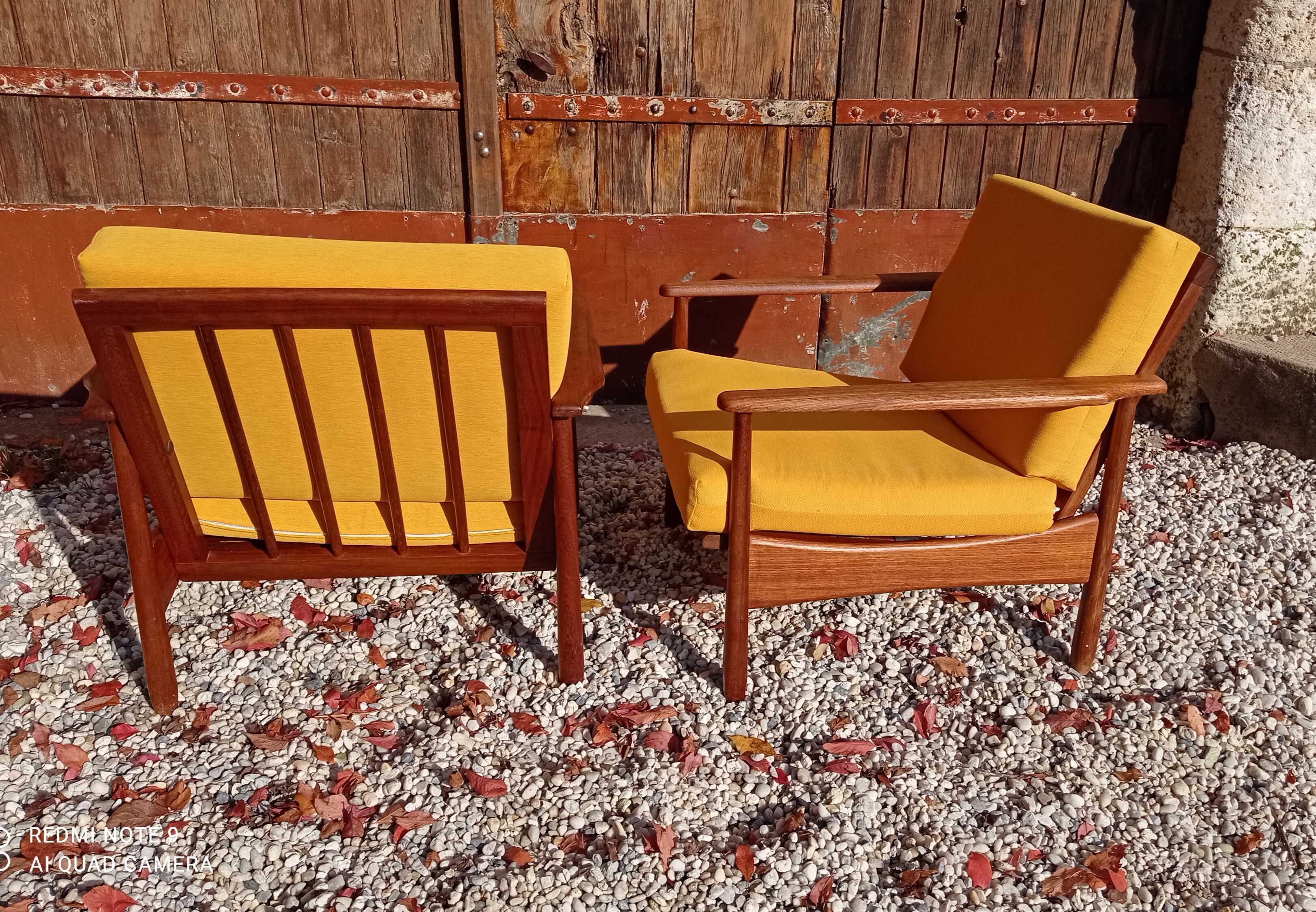 Pair of teak armchairs