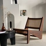 Reclined armchair in canned teak in natural wood