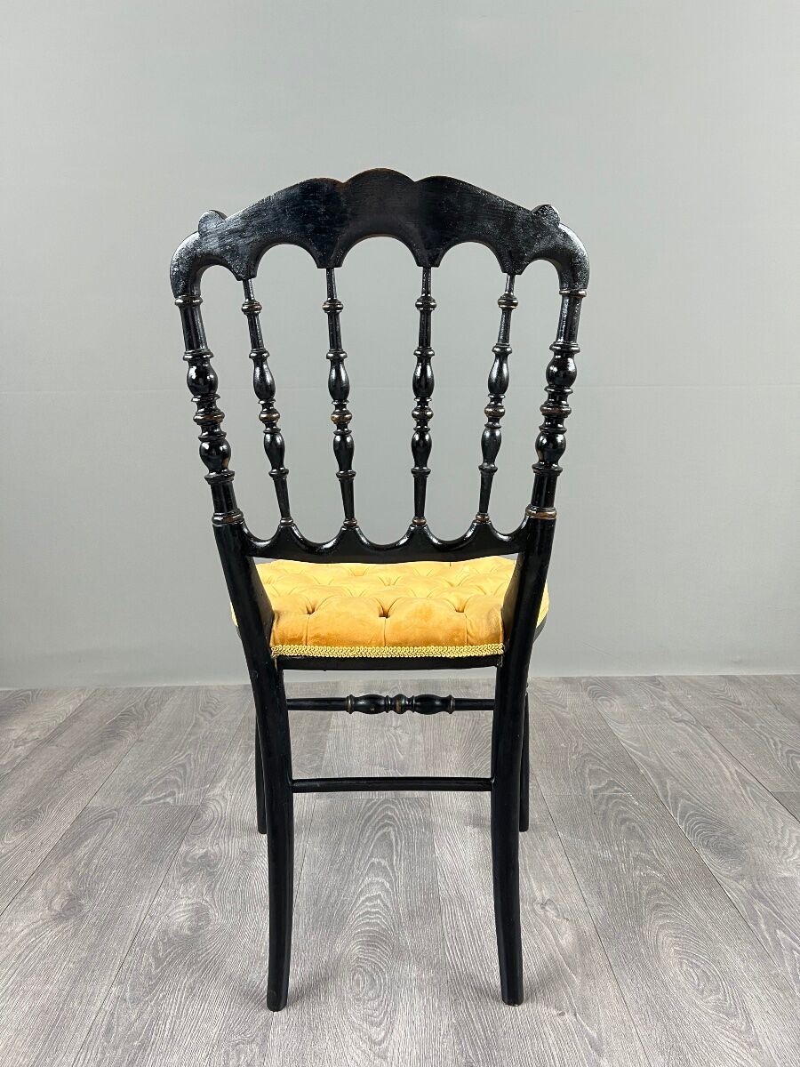 Set of four Napoleon III chairs in blackened wood, 19th century.