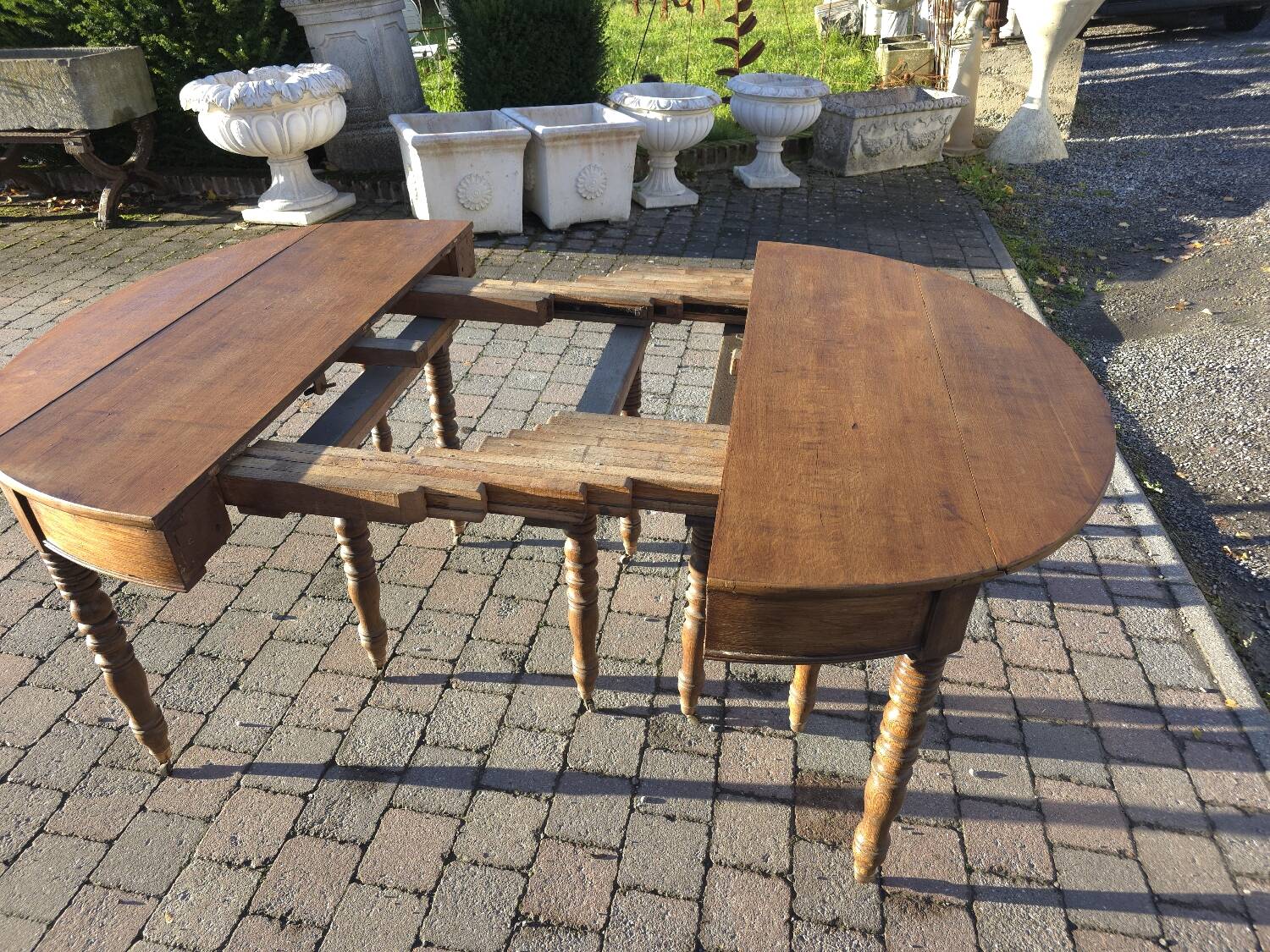 12-foot round oak table with 7 extensions / 20 people