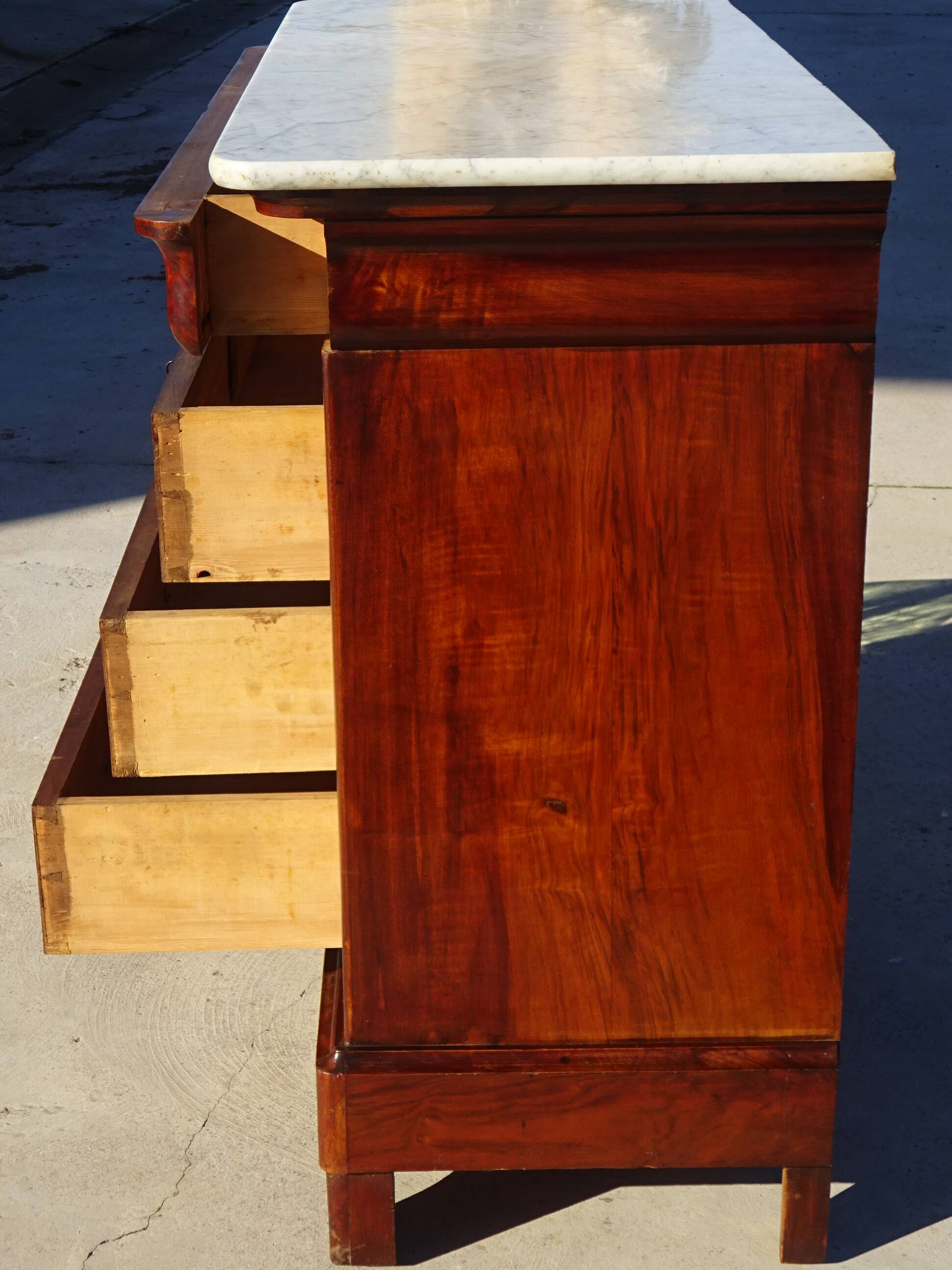 Antique mahogany chest of drawers with white marble.