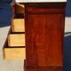Antique mahogany chest of drawers with white marble.