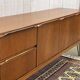 1970s English enfilade in teak with splayed legs.