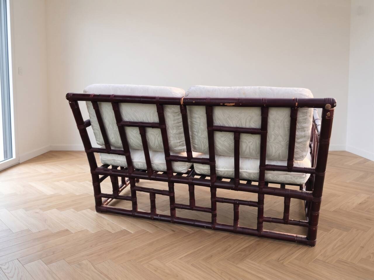 Two-seater sofa set and small lacquered violet rattan table.