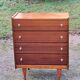 Vintage golden oak chest of drawers with 4 spindle feet from the 1950s