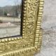 19th-century antique mirror in carved gilded wood, Napoleon style.