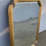 Miroir doré contour ligné