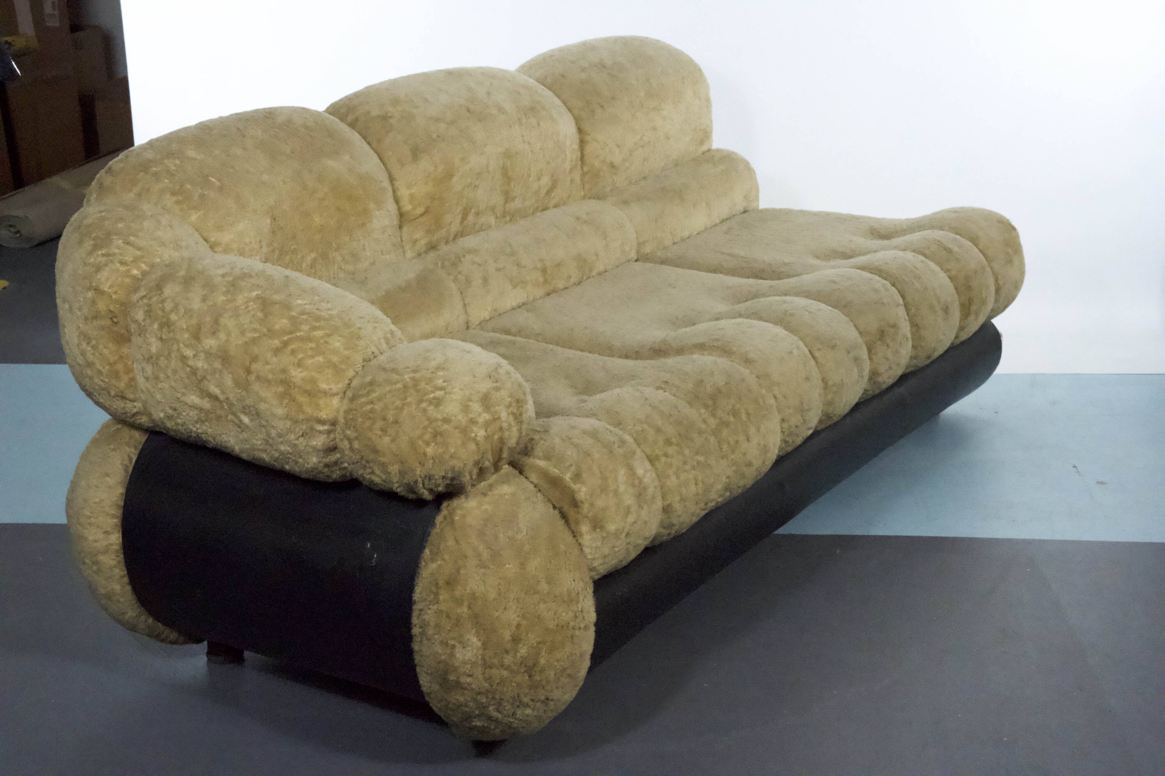 three-seater sofa designed by Adriano Piazzesi, produced in Italy during the 1970s. Upholster