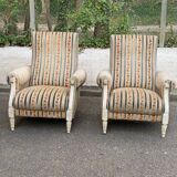 2 Louis XVI bergère armchairs in solid wood with beige and blue embroidered fabric.