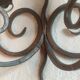 Old pair of wrought iron wall lights