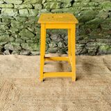Yellow wooden high stool