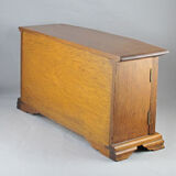 Wooden jewelry box in the shape of a chest of drawers