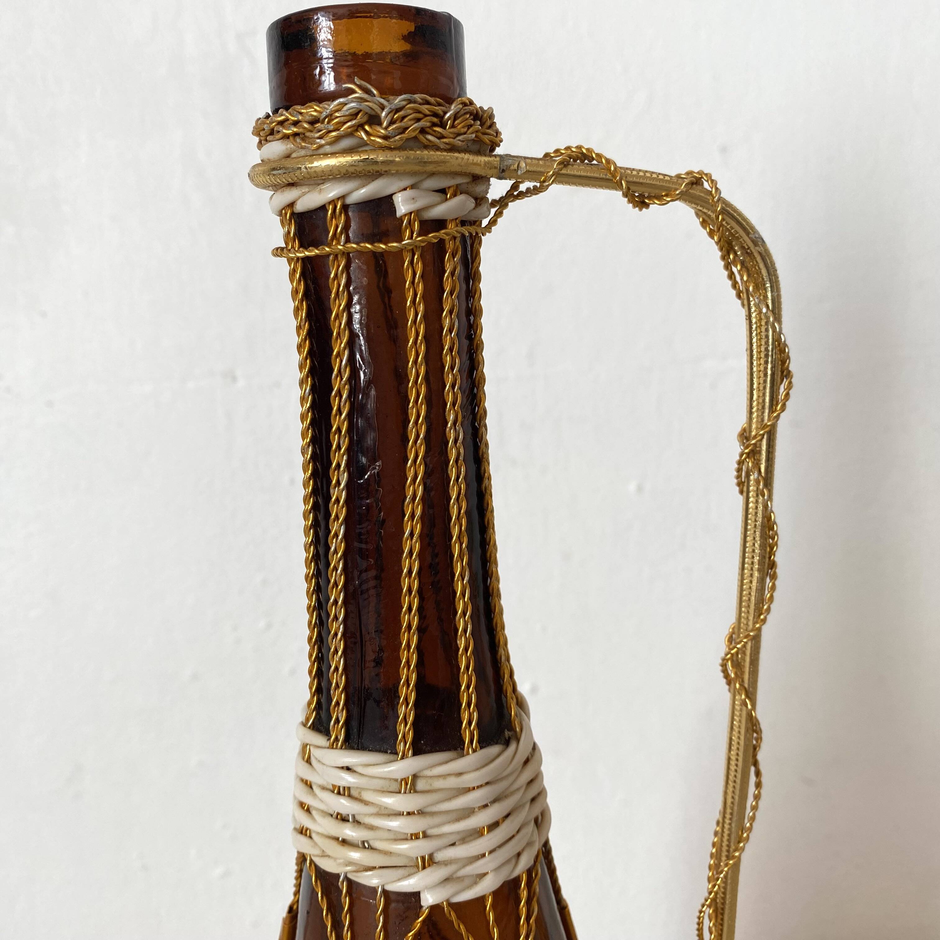 Amber glass bottle and scoubidou