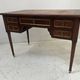 Louis XVI style desk in mahogany and mahogany veneer, 20th century.