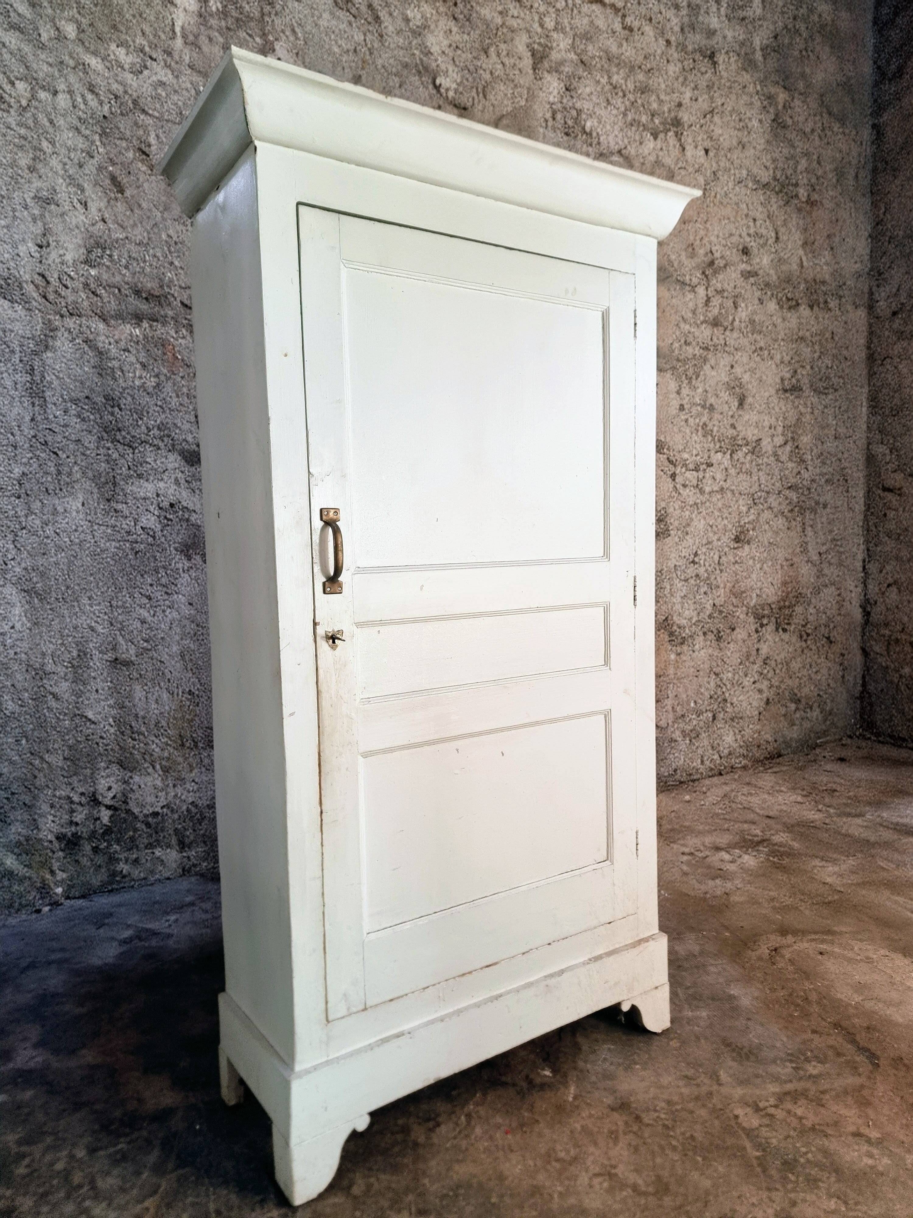 Antique French pine wardrobe with original white paint, circa 1900–1920.