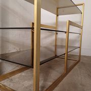 Brass shelf, smoked glass
