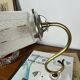 Vintage brass wall light with Art Nouveau tulip shade.