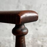 Dark brown solid wood Arts & Crafts armchair with natural rush seat and high back