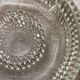 Under vintage bottles or carafes
